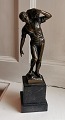 Bronze figure by Ernst Beck: Man with stones