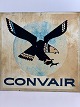Part of an 
aircraft (now 
used as an old 
metal sign) 
bearing the 
CONVAIR logo, 
which shows a 
...