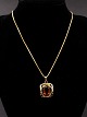 8 carat gold 
necklace 41.5 
cm. with 
pendant 1.8 x 
2.3 cm. with 
smoked topaz 
from jeweler 
Herman ...