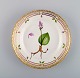 Royal Copenhagen Flora Danica salad plate in hand-painted porcelain with flowers 
and gold decoration. Model number 20/3573.
