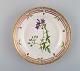 Royal Copenhagen Flora Danica salad plate in hand-painted porcelain with flowers 
and gold decoration. Model number 20/3573.
