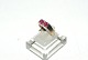 Gold Ladies 
ring with pink 
stones in 14 
carat gold
Stamped 585 
JSK
Size 56
Checked by ...