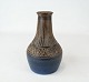 Ceramic vase in 
dark colours 
and with 
unknown 
signature.
18,5 x 9 cm.