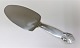 Georg Jensen. 
Silver cutlery. 
Sterling (925) 
Bittersweet. 
Cake spade. 
Length 21.8 cm. 
Produced ...