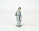 Stoneware 
figure with 
light blue 
glaze by L. 
Hjort.
13 cm.