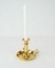 Candlestick 
with handle of 
brass, in great 
used condition 
from the 1890s.
12 x 12 cm.
