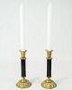 A pair of 
candlesticks of 
brass with 
black metal, in 
used condition 
from the 1920s.
18 x 7.5 cm.