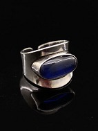 N E From sterling silver ring with blue stone