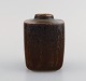 Valdemar Pedersen for Bing og Grøndahl. Vase in glazed stoneware with grooved 
body. Beautiful glaze in brown shades. 1960