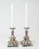 A set of 
silvered rococo 
candlesticks, 
in great used 
condition from 
the 1920s.
18 x 10.5 cm.
