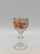 Enamel 
decorated dram 
glass Front 
with older 
repair 
"riveted" 
Height 8.8cm.
