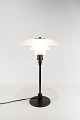 PH 3/2 table 
lamp with black 
stem and matt 
glass shades, 
designed by 
Poul Henningsen 
and ...