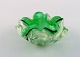 Murano bowl in 
green and clear 
mouth blown art 
glass. Wavy 
shape. Italian 
design, ...