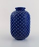 Gunnar Nylund for Rörstrand. Chamotte vase in glazed ceramics with spiky 
surface. Beautiful glaze in shades of blue. 1950s.
