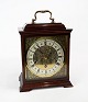 Fireplace clock of mahogany, in great antique condition.25 x 22 x 13 cm.