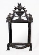 Rococo mirror with black painted wooden frame with carvings, in great antique 
condition from the 1780s.
5000m2 showroom.