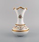 Limoges vase in 
hand-painted 
porcelain with 
floral and gold 
decoration. 
1920's.
Measures: 20.5 
...