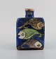 European studio ceramist. Triangular vase in hand-painted glazed ceramics 
decorated with fish. 1960/70