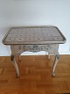 Rococo tile 
table with 
extension for 
candlesticks 
Curved legs 
decorated with 
bluish flowers 
...