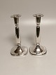 A pair of 
Swedish table 
tops of silver 
height 18cm. 
Appears in used 
condition.