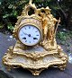 French gilded zinc fireplace clock, newrococo, 19th century. Decorated with rocailles and ...