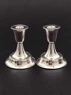 A pair of 0.900 silver candlesticks