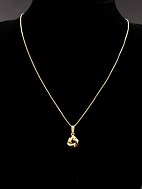 10 carat gold chain 49 cm. and 14 carat knot pendant
