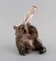 Royal Copenhagen porcelain figurine. Faun pulling bear