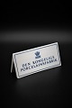 Old dealer sign 
in porcelain 
from Royal 
Copenhagen "Den 
Kongelige 
Porcelænsfabrik" 
H:6cm. ...