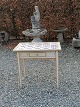 Tile table with 
15. 1800s 
softly 
decorated tiles 
Table tendons 
Height 68cm 
Plate 71 x 
45cm.