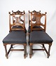 Set of four 
dining room 
chairs in 
walnut and 
newly 
upholstered 
with black 
fabric, from 
the ...