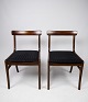 A pair of 
Rungstedlund 
mahogany dining 
chairs, 
designed by Ole 
Wanscher and 
manufactured by 
P. ...