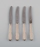 Four Evald 
Nielsen number 
14 small lunch 
knives in 
hammered silver 
(830) and 
stainless 
steel. ...