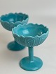 Turquoise / 
light blue 
footed glass 
bowls. The 
bowls are made 
of pressed 
glass (milk 
glass) and ...