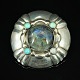 Georg Jensen; An early silver brooch set with a labradorite and opals #50 (1904 
- 1908)