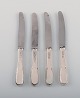 Four Evald 
Nielsen number 
14 small lunch 
knives in 
hammered silver 
(830) and 
stainless 
steel. ...