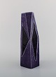 Vilhelm Bjerke Petersen (1909-1957) for Rörstrand. Fasett vase in glazed 
ceramics. Beautiful glaze in purple shades. Mid-20th century.
