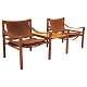 A pair of Arne Norell Scirocco rosewood safari chairs with table. Both chairs 
with original label. Design Sweden 1964