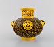 Antique Zsolnay vase in openwork glazed ceramics. Beautiful glaze in yellow and 
brown shades. Dated 1882-1885. Museum quality.
