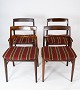 A set of four 
dining chairs 
in rosewood and 
striped fabric, 
of Danish 
design from the 
1960s, ...