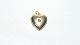 Elegant pendant 
/ charms Heart 
Medajlion in 14 
carat gold
Stamped 585
Nice and well 
maintained ...