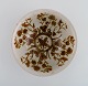 European studio ceramicist. Unique bowl in glazed stoneware with flowers. 1970s.
