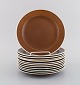 Stig Lindberg 
for 
Gustavsberg. 
Twelve Coq 
plates. 
Beautiful glaze 
in brown 
shades. ...