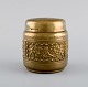 Brass cigarette 
container with 
classicist 
scenes. 
Mid-20th 
century.
Measures: 9.5 
x 9 cm.
In ...