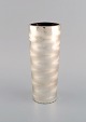 WMF, Germany. 
Ikora vase in 
silver plated 
brass. Mid-20th 
century.
Measures: 22.5 
x 9 cm.
In ...