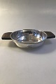 French Silver 
Dish (950) 
Wooden handles 
Engraved 
Measures  H 3 
cm (1 3/16 
in)Diam 12 cm(4 
23/32 ...