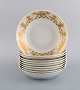 Bjørn Wiinblad for Rosenthal. 10 deep plates in porcelain with gold decoration. 
1980s.

