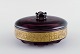 MOSER KARLSBAD lidded jar in purple mouth blown art glass. 
Brass edge with scenery. 1930s / 40s.
