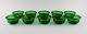 Kaj Franck (1911-1989) for Nuutajärvi. 10 Luna seafood bowls / rinse bowls in 
green mouth blown art glass. 1970s.
