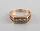 Danish jeweler. Vintage art deco ring in 14 carat gold adorned with three 
diamonds. Mid-20th century.
